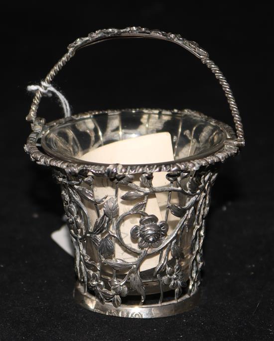 A George III silver cream pail, pierced with floral design, London 1768, William Vincent (base a.f), with clear glass liner